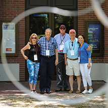 Group of people smiling. Links to What to Give